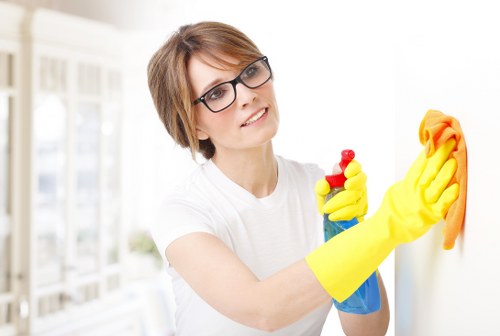 Local cleaner preparing a furnished apartment in Merton for a turnover clean